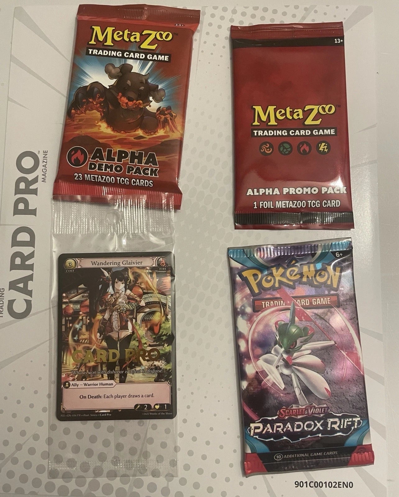 Card Pro Magazine VOLUME 1. Sealed. Pokemon Pack, Meta Zoo Alpha Promo & Alpha Demo Packs. Grand Archive Wandering Glaivier EXCLUSIVE Card Pro Promo Card. 100 Page Magazine. 36 Page Metazoo Mag.